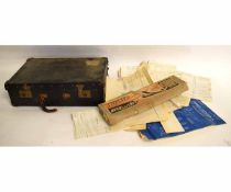 Black rexine pine lined case containing a quantity of vintage aeroplane kit instructions and