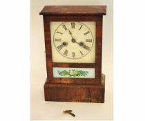 Mantel clock with wooden case, the front with an inset panel and floral sprays, 30cms high