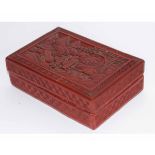 20th century Chinese cinnamon lacquer box of rectangular shape, the lid carved with figures in a