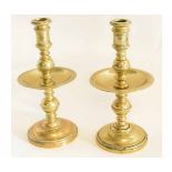 Pair of 17th century style brass candlesticks with circular foot with knopped column with drip tray,