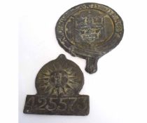 Vintage lead fire mark with raised sun, serial no 425573, together with a larger lead fire mark of