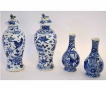 Group: pair of 19th century Chinese blue and white baluster lidded vases, decorated with birds