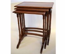 Good quality reproduction mahogany set of three nesting tables on bamboo turned columns supported on