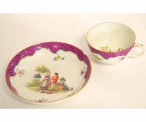 Meissen cup and saucer, late 18th/early 19th century, the puce scale ground with a couple in a