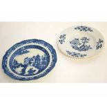 Delft plate together with a pearlware plate, decorated with a temple design, largest 25cms