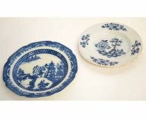 Delft plate together with a pearlware plate, decorated with a temple design, largest 25cms