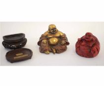 Chinese cinnamon lacquered Buddha on carved treen base, together with a further gilded example