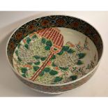 Large 19th century Japanese porcelain bowl decorated in polychrome enamels with a floral design
