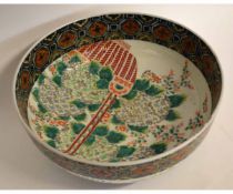 Large 19th century Japanese porcelain bowl decorated in polychrome enamels with a floral design