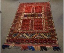 Caucasian wool carpet, multi-gulled border, mainly red field (with hangers), 122 x 194cms