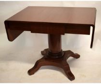 19th century mahogany pedestal sofa type table with two drop flaps to end on a turned column on a