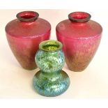 Pair of early/mid-20th century iridescent ruby glass vases of tapering circular form, 19cms tall,
