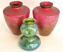 Pair of early/mid-20th century iridescent ruby glass vases of tapering circular form, 19cms tall,