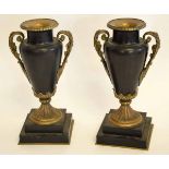 Pair of classical style urn shaped vases with metal mounts on square metal stepped bases, 30cms high