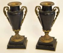 Pair of classical style urn shaped vases with metal mounts on square metal stepped bases, 30cms high