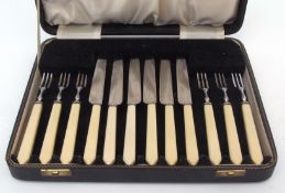 Mid-20th century cased set of six each dessert knives and forks with composite handles and