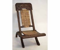 Hardwood Chieftain's chair of X-frame folding form with cane back and seat