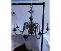 Reproduction brass Persian style eight-branch electrolier with scrolling arms with candle stylised