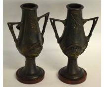 Pair of metal Art Nouveau vases on an onyx style base