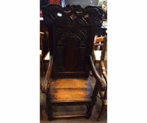 19th century wainscot chair with carved and panelled back with carved dragon formed top rail on