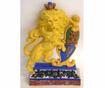 Good quality cast iron and painted doorstop modelled as a lion passant with heraldic shield, 40cms