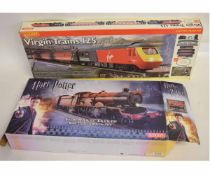 Boxed Hornby Virgin Trains 125 electric train set together with a further boxes Harry Potter