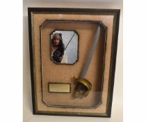 Framed limited edition Pirates of the Caribbean sword, signed by Johnny Depp with photo and plaque