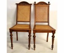 Pair of 19th century European dining chairs with cane backs and seats (one with missing finials)