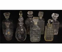 Collection of nine various lead crystal and other glass decanters, various shapes and sizes, largest