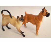 Pair of Royal Doulton models, one of a Boxer dog, HN2643, and one of a Siamese cat, HN2660, the