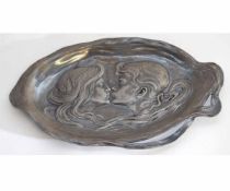 WMF shaped pewter dish depicting two figures to centre in a stylised design with raised mark of