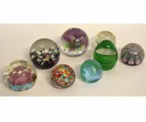 Collection of eight glass paperweights including a Caithness example, No 753 from a limited