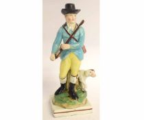 Late 18th/early 19th century pearlware model of a huntsman with dog by his side, on square base,