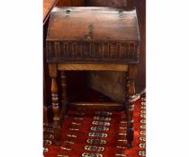 Late 17th/early 18th century oak slope fronted Bible box with carved front with original hinges,