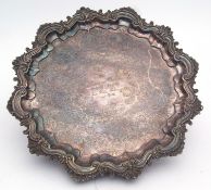 Silver on copper salver, of shaped circular form with C-scroll and foliate applied rim, engraved