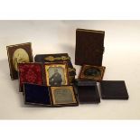 Six assorted leather cased Ambrotypes with family portraits, together with two brass mounted photo