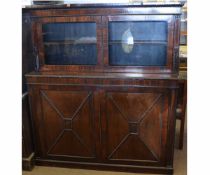 Rosewood side cabinet fitted throughout with beaded mounts, glazed top over two panelled doors