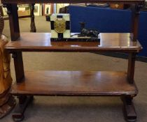 19th century mahogany three-tier buffet with planked ends with scrolling supports raised on four bun