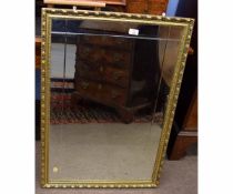 Late 20th century rectangular wall mirror with gilt frame with repeating design and bevelled