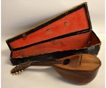 Mandolin with label of J G Carter, together with its original rexine case