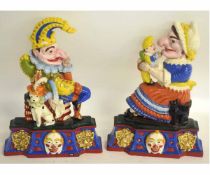 Pair of good quality painted cast iron doorstops modelled as Punch & Judy on decorative shaped