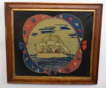 Wool work picture depicting a three-masted vessel in a maple frame, (glass cracked) 41cms x 47cms