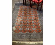 Good quality grey and rust Bokhara type carpet with multi-gulled border (a/f), 164cms wide x