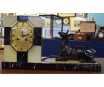 Art Deco onyx, slate and marble mantel clock with brass dial of Cowyn Hazebrouck, with a spelter