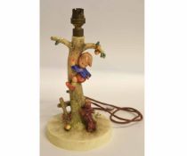 Goebel figure adapted as a lamp with a boy climbing a tree, 25cms high