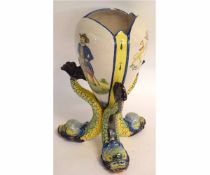 Majolica style vase, the ovoid vase supported on three fish feet, 32cms high