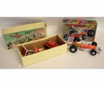 Boxed Champion Race car together with a further Dan Dare remote control helicopter, by Nulli Scundus