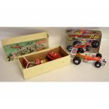 Boxed Champion Race car together with a further Dan Dare remote control helicopter, by Nulli Scundus