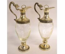 Two Italian silver plated mounted glass claret jugs, 30cms high