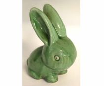 Art Deco 1930s style model of a rabbit with green glaze, 20cms high